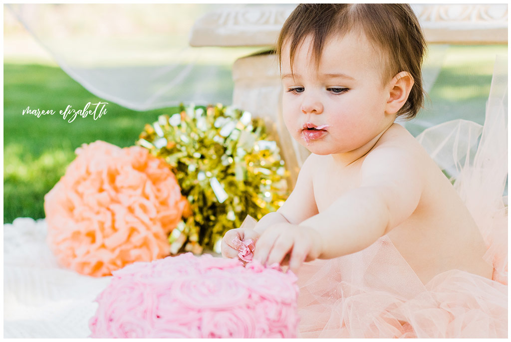 DIY Little Girl Cake Smash | Emi's one year old cake smash had a cute little girl theme. We got the decorations on the facebook marketplace and I made the cake myself. | Arizona Family Photographer | Maren Elizabeth Photography