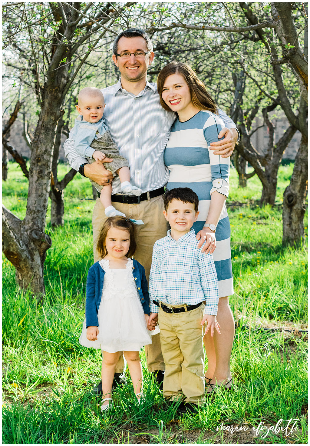 Provo Orchard Family Pictures in the spring. The family chose a neutral blue pallet for their outfits which was perfect for the season! | Gilbert Photographer