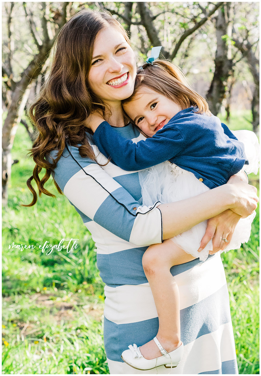 Provo Orchard Family Pictures in the spring. The family chose a neutral blue pallet for their outfits which was perfect for the season! | Gilbert Photographer | Mommy & Me