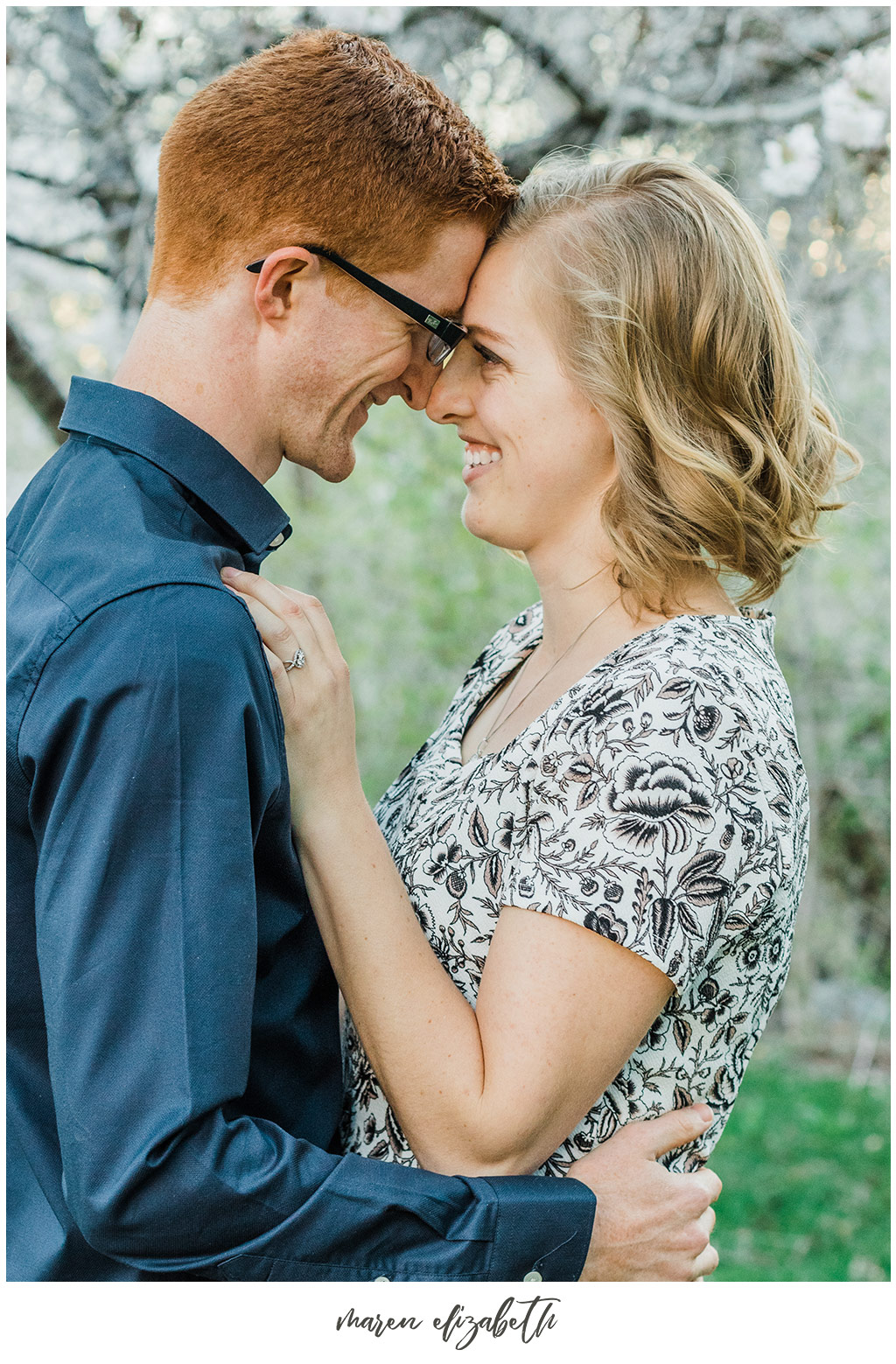 Provo river trail engagement pictures taken on the bridge behind the Riverwoods. It was the beginning of April and we got lucky and caught the blossoms without even trying! | Arizona Photographer | Maren Elizabeth Photography