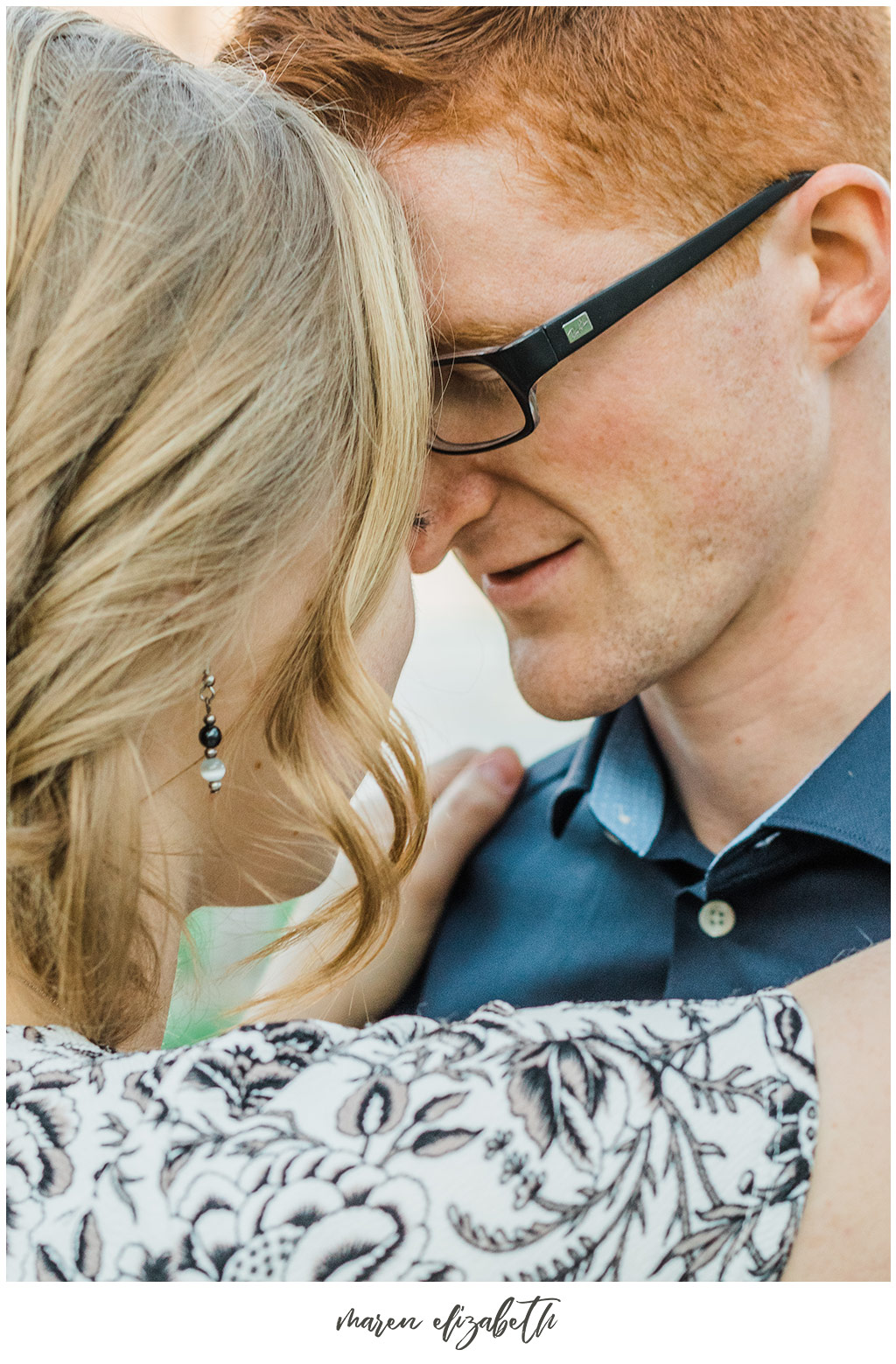 Provo river trail engagement pictures taken on the bridge behind the Riverwoods. It was the beginning of April and we got lucky and caught the blossoms without even trying! | Arizona Photographer | Maren Elizabeth Photography