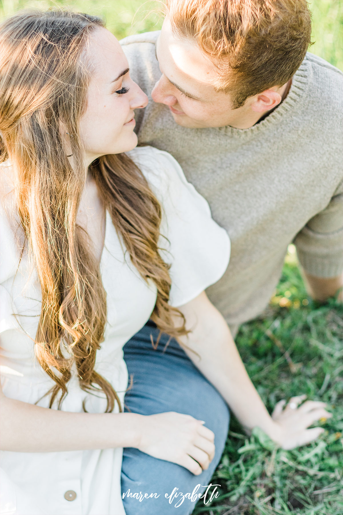 Spring engagement pictures at Burgess Orchards in Alpine, UT with a perfect view of the mountains. | Maren Elizabeth Photography