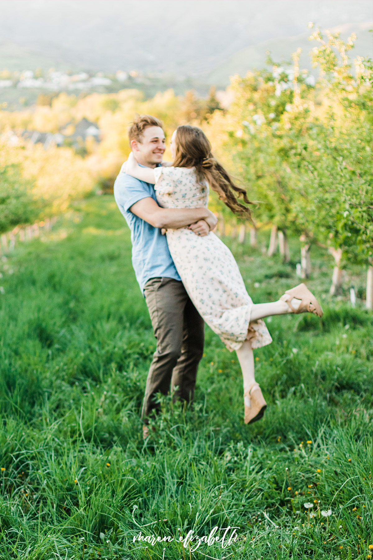 Spring engagement pictures at Burgess Orchards in Alpine, UT with a perfect view of the mountains. | Maren Elizabeth Photography