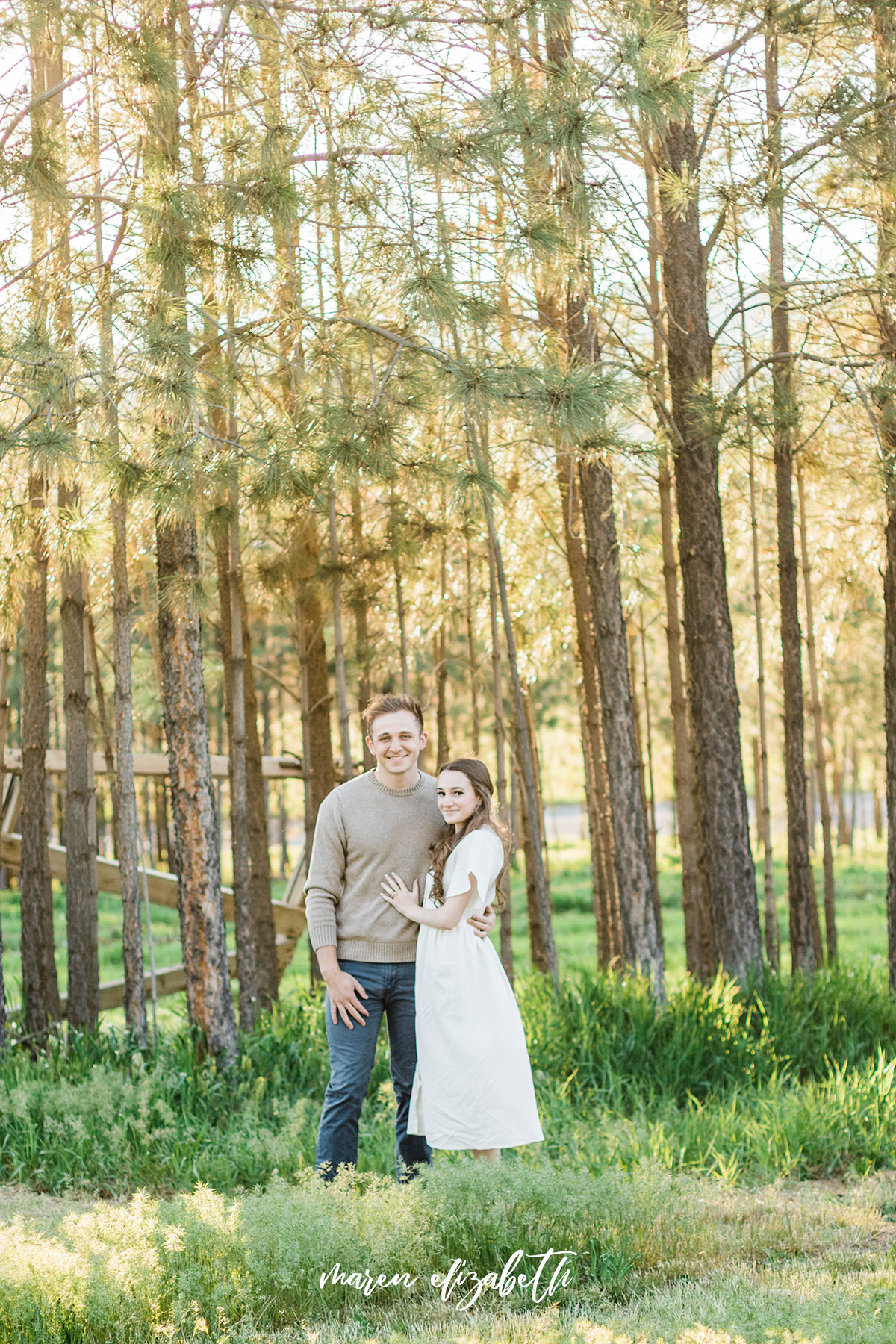 Spring engagement pictures at Burgess Orchards in Alpine, UT with a perfect view of the mountains. | Maren Elizabeth Photography