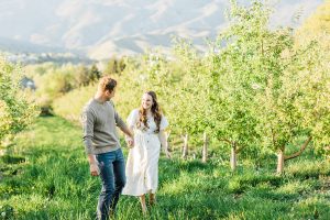 Spring engagement pictures at Burgess Orchards in Alpine, UT with a perfect view of the mountains. | Maren Elizabeth Photography